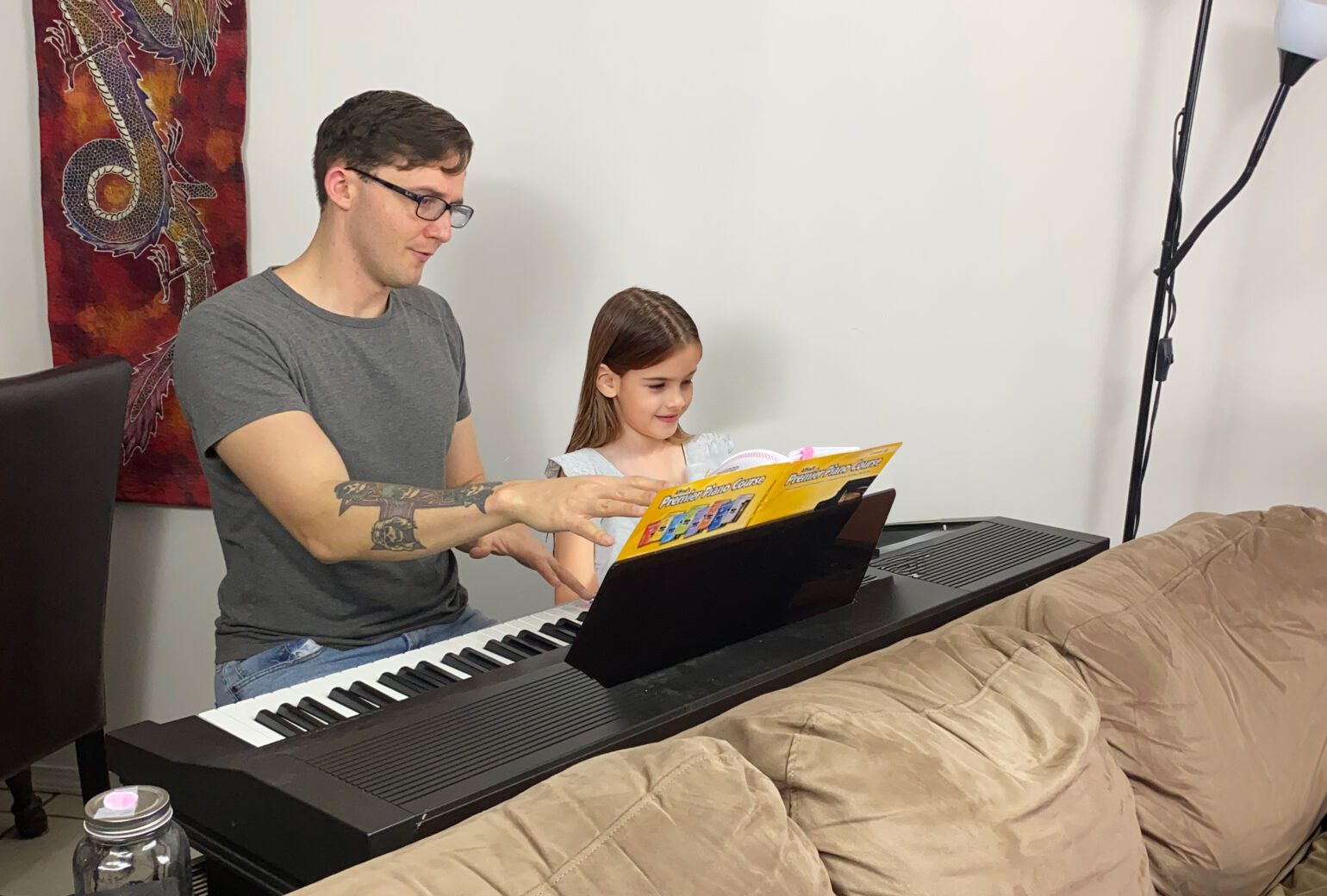 Kelowna PIano teacher instructing a young girl during a lesson
