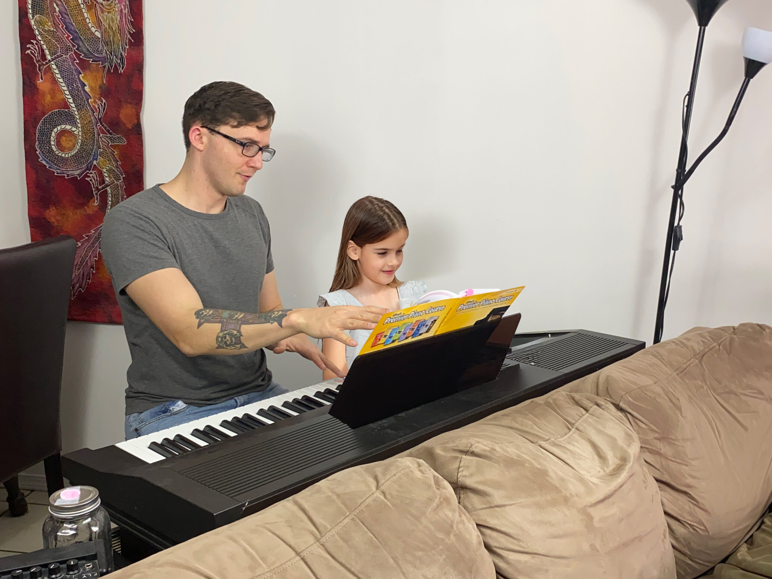 Kelowna PIano teacher instructing a young girl during a lesson
