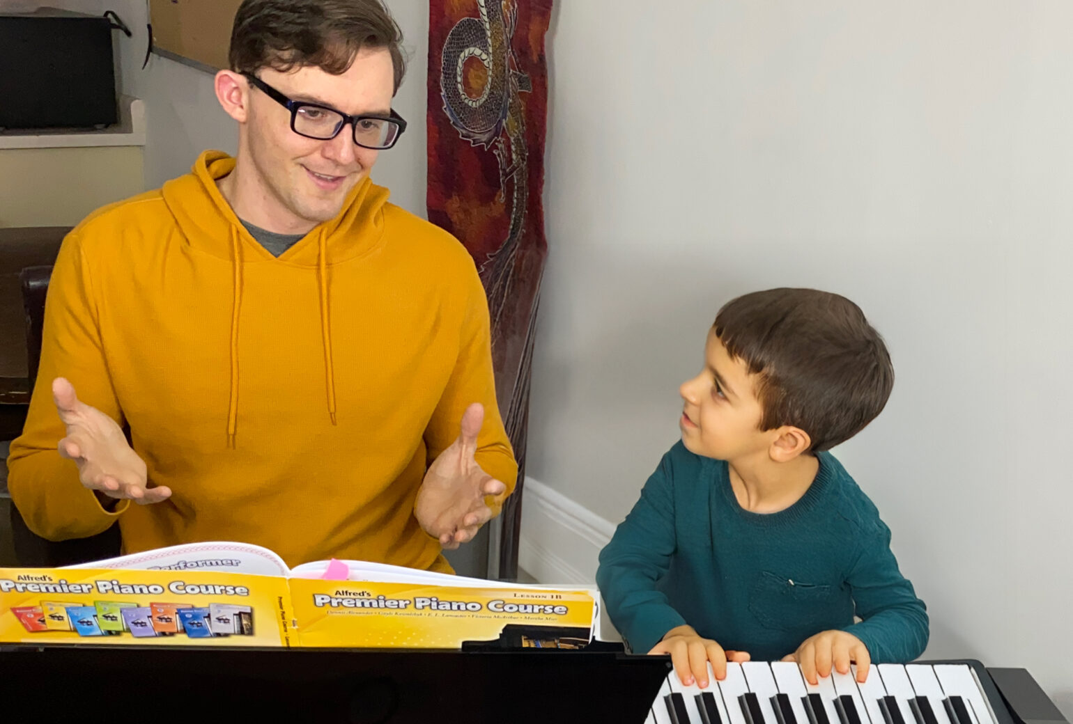 Alex teaching a young student piano at his studio in Kelowna
