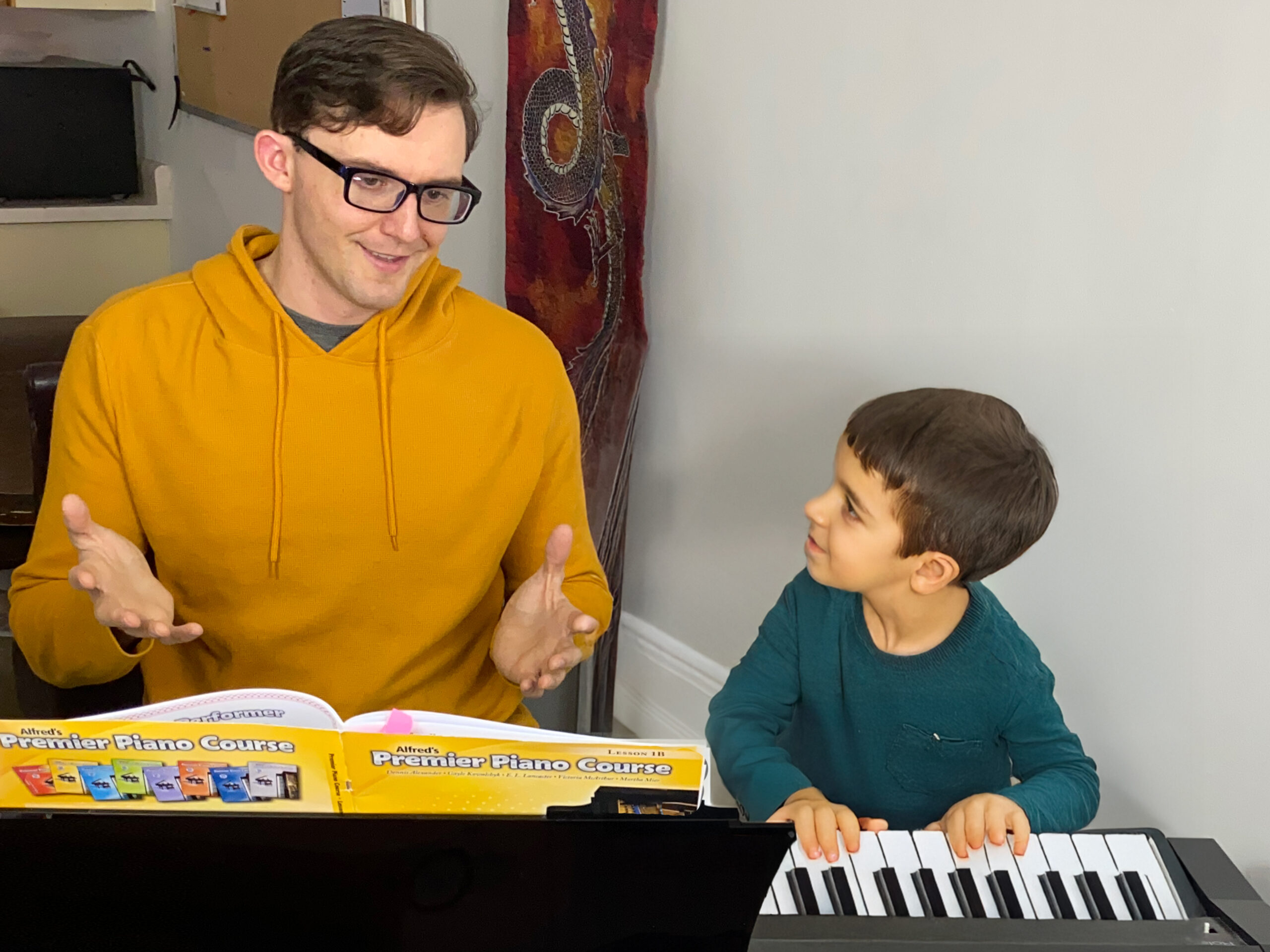 Alex teaching a young student piano at his studio in Kelowna