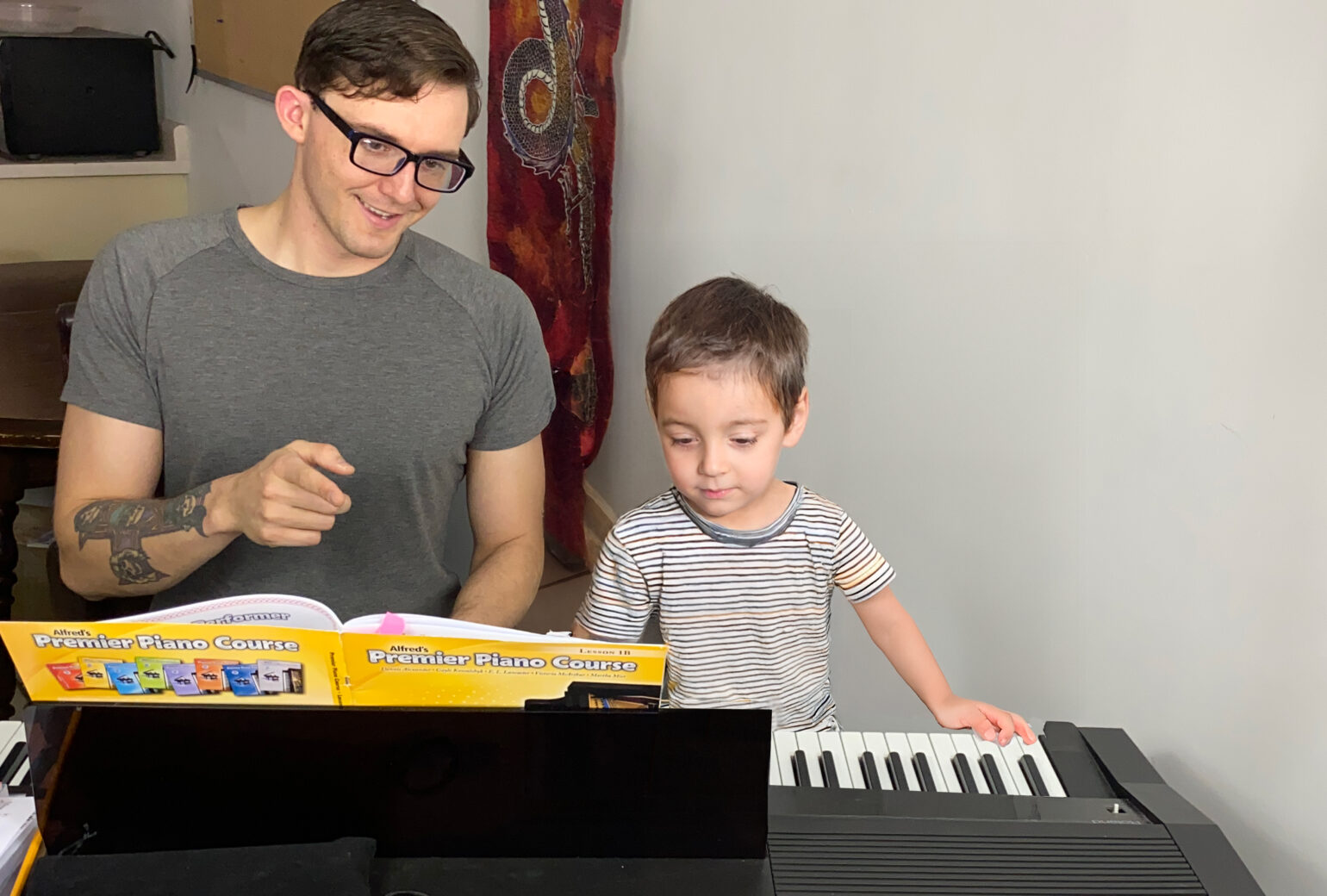 Teacher Alex Stacey at Upnotes Music teaches a young boy in Kelowna